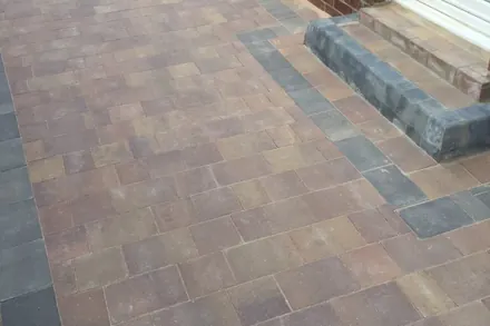 Large block-paved drive with a charcoal border and a new block step